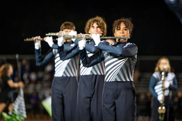 Summit High band members march
